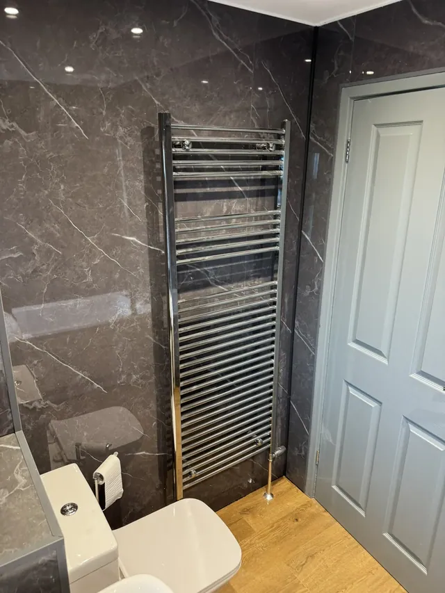 Bathroom towel rail, painted door and floor finish